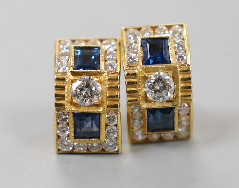 A modern pair of yellow metal, sapphire and diamond cluster set curved rectangular earrings, 14mm, gross weight 5.2 grams.